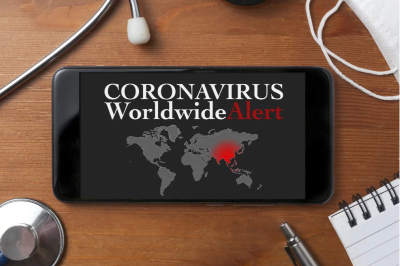 a smartphone displaying the text coronavirus worldwide news