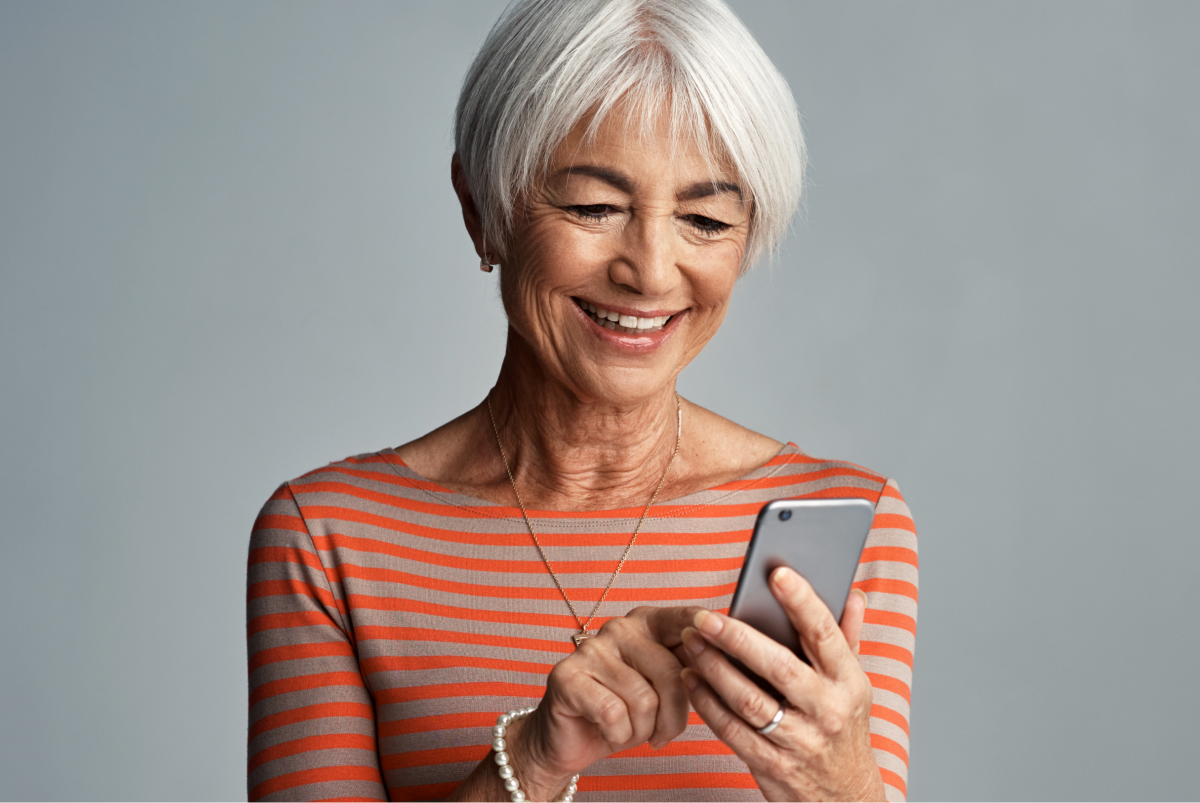 Older woman enjoying her digital therapeutic solution which has been delivered via an app on her cellphone.